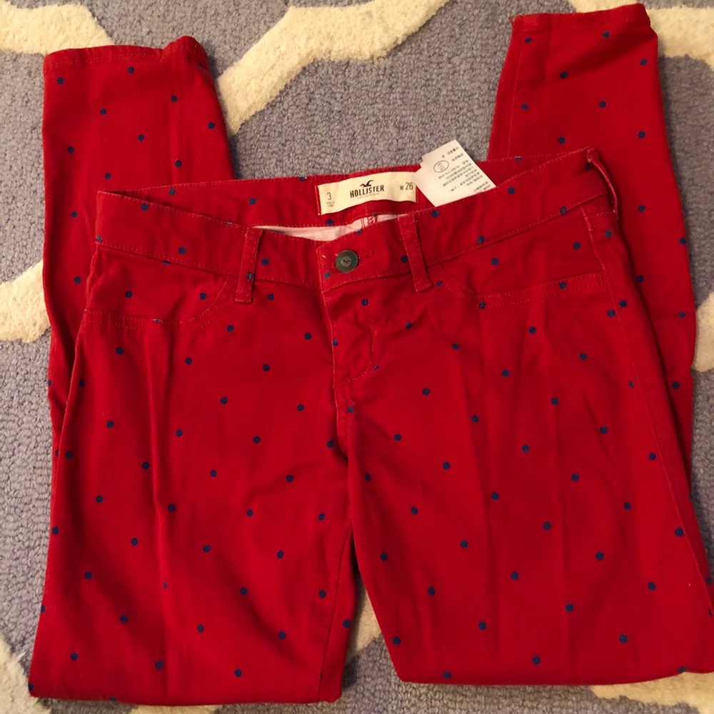 Red skinny pants with navy polka dots